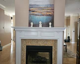 mantle picture with statues figurines