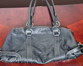 PRADA BLACK LEATHER PURSE | PRADA branded black leather purse with take on inside labeled “Prada / Milano / Made in Italy". - h. 6 x w. 6 x l. 18 in