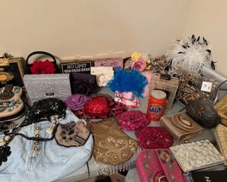 Purses, many styles, themed, many designers, one of a kind and named brands