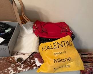 Purses, many styles, themed, many designers, one of a kind and named brands