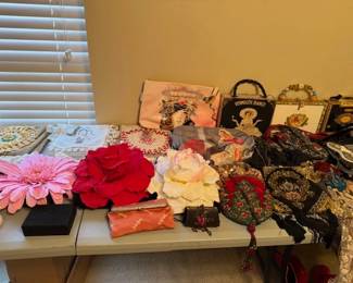 Purses, many styles, themed, many designers, one of a kind and named brands