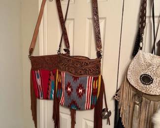 Purses, many styles, themed, many designers, one of a kind and named brands