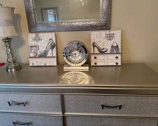 Matches padded queen bed, dresser is two drawers side by side and decorative mirror to accent