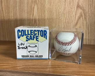 Lou Brock Signed Baseball & Holder