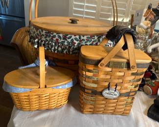 Longaberger XL sewing basket $160. Century anniversary 2000 basket  $45. Collector’s Club Charter Member 1997 to 2004 metal badges $95