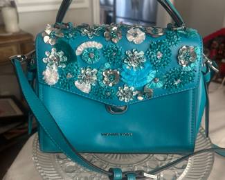 RARE Michael Kors Turqoise leather handbag with handle and cross body  strap. Bling is  silver, etc. this one is $250 Matching small wallet for $70 Total is $320 for both like new