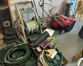hoses, trencher, snow blower, plant baskets, lawn chairs