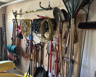 rakes, shovels, extension cords, outdoor yard tools