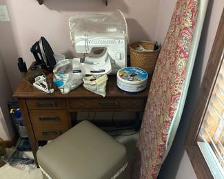 sewing machine and materials, ironing board, wooden sewing machine desk, sewing chair with storage, wood shelf with hearts