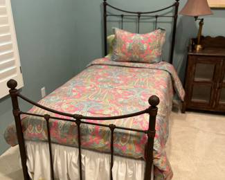 This is Wesley Allen wrought iron beds in a rich color that works effect in a kids or guest room.
