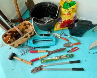 Variety of hand/garden tools and accessories; potting mix, sprayer, watering can, sprinkler...