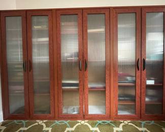 Great storage! Three separate cabinets with doors, shelves...