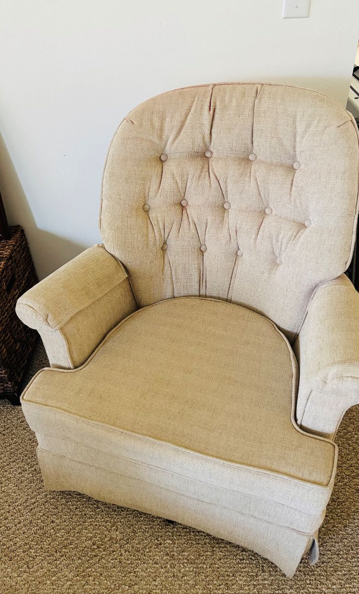 Chair with buttons.  Why is it called an armchair?  Why not button chair?  Who decides these things?