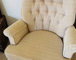 Chair with buttons.  Why is it called an armchair?  Why not button chair?  Who decides these things?