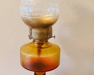 You call it a kerosene lamp.  I grew up in Louisiana, it's a hurricane lamp.  