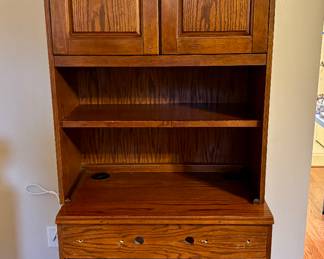 Some type of tall computer desk.  You do not have to be tall to use it.  