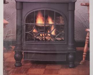 Cast iron gas fire place. New in the box.