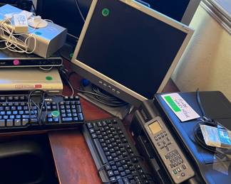 Lots of monitors and computer equipment