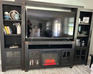 Black Entertainment Center with Fireplace. 65" LG Smart TV sold seperately.