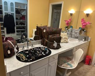 Lavish Primary Room En Suite Bathroom with a Great Selection of Jewelry, Bedding and More.