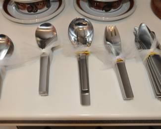 Spectacular Georg Jensen "Blue Shark" Mid Century Stainless Flatware Made in Denmark, Four Piece Place Setting for 12 with 2 Cocktail/Meat Forks and 4 Serving Pieces 