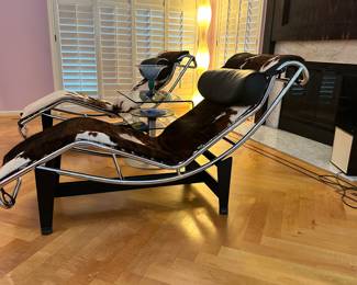 Side View of the Italian Le Corbusier Polifred Chaise Lounge Cowhide Chairs From Design Within Reach