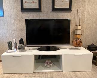 Low Media Center with Two Pull Out Drawers and Central Glass Shelf, 71"W x 26"D x 15.5"H Shown with Great Inuit Art Pieces and More.