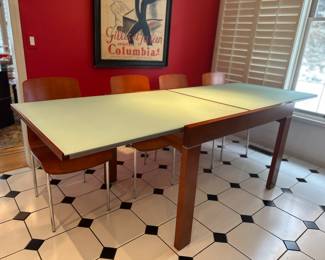 Design Within Reach Spanna Dining Table Easily Extends with a Simple "lift and slide" Design, 29.5"H x 40-94"W x 35"D.