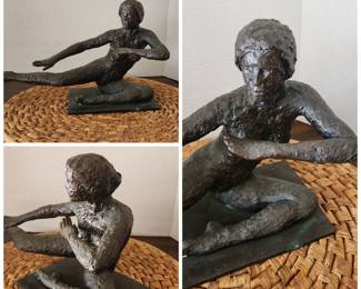 bronze sculpture, male in a seated pose