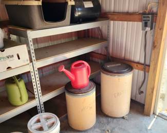 Dog house, yard items, cardboard barrels with lids,