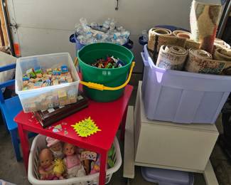 Rugs in bin.  Kids toys