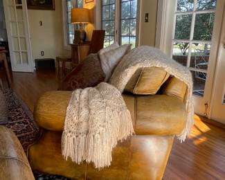 Robinson & Robinson Hand Finished Saddle leather occasional chair. 
Mohair woven throw 