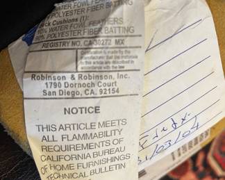 Detail pic, tag on Robinson & Robinson Hand Finished Saddle leather Sofa customized with a Creme Velvet tufted box cushion. 
7' long • 36" deep • 31" tall