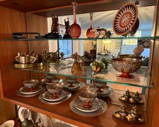 Odds and ends on the shelf. Zoom in to see details—very nice teak display case with two matching shelves.