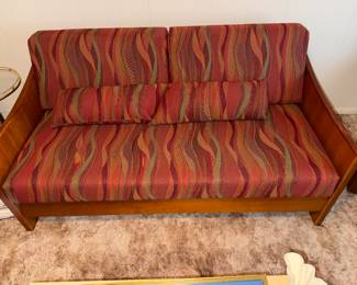 Teak Danish fold-out futon with original upholstery. It also comes with a cover, Very good condition.
