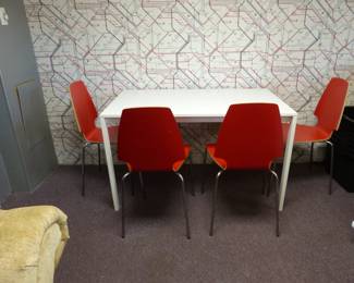 Kitchen table with 4 orange chairs
