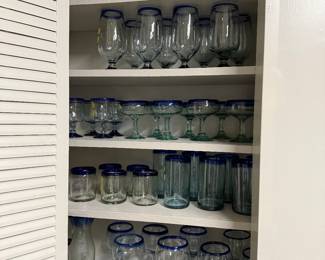 Many different sets of Blue Mexican glass.