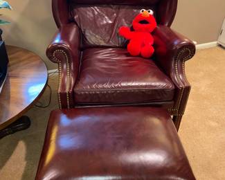 Elmo gives a thumbs up on this leather wingback armchair and ottoman