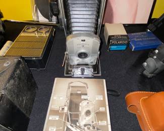 Vintage Polaroid land camera  fold up camera with paperwork