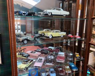 Large enclosed display shelving unit with glass shelves and mirrored back 