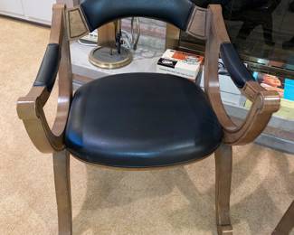 1 of a pair of leather MCM chairs 