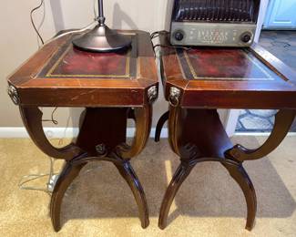 Unique leather top end tables with curved legs and metal lion corner accents