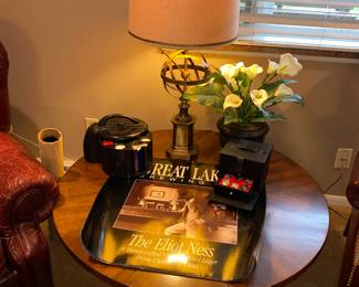 Round MCM coffee table- Great Lakes Brewery posters- unique sundial style lamp