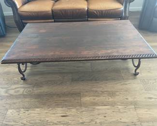 Wooden coffee table with iron legs