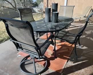 Oval wrought iron patio table with 2 swivel chairs + 2 regular