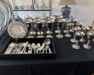 Silver plate items: bowl + tray, silverware + utensils, pitcher, platters, coupe drinkware, silverware