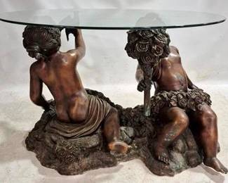 76 - Bronze Cherub Base Glass Top Table 32 x 48
