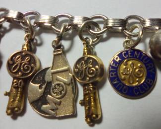 25 year rocket and quarter century are both 10 kt gold.