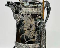 Antique tilting water pitcher