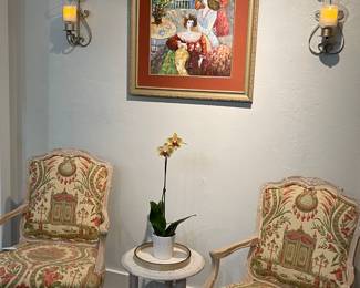 These two upholstered bergère chairs and art still available.